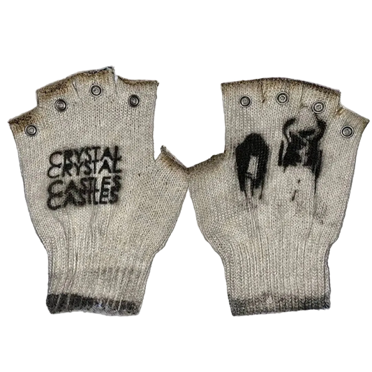 Pair of knitted fingerless gloves with text and design on a textured surface